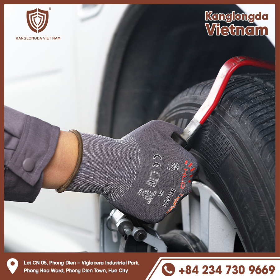 Impact and abrasion resistant gloves protect hands when repairing car wheels.